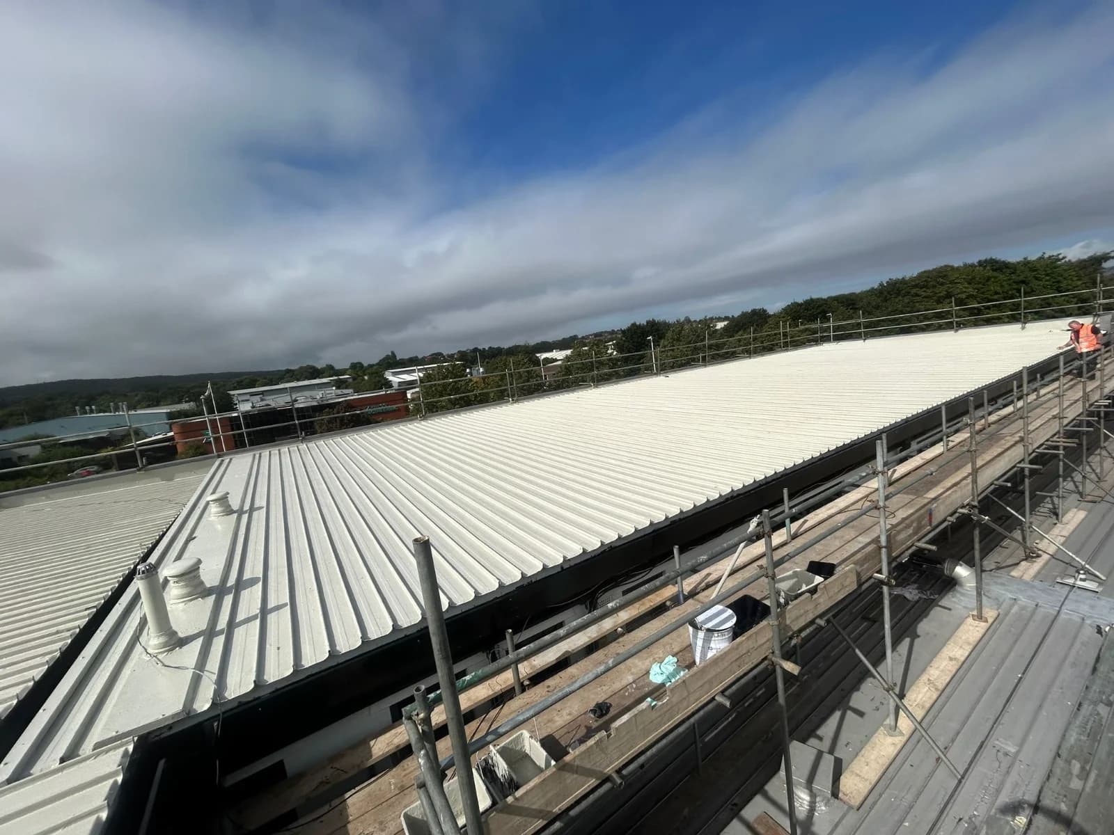 A completed standing-seam metal roof on a commercial building